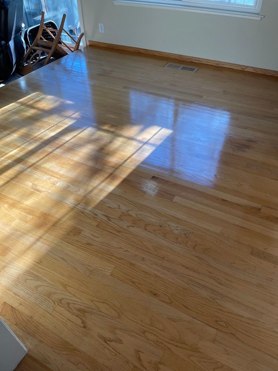 Refreshed hardwood floors after professional cleaning in Dallas